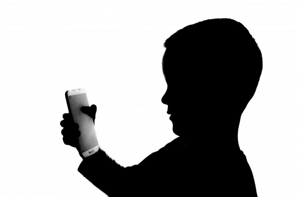 Boy Looking At Phone Shadow